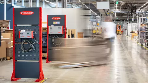 Two SelectION lithium-ion battery chargers in a warehouse.
